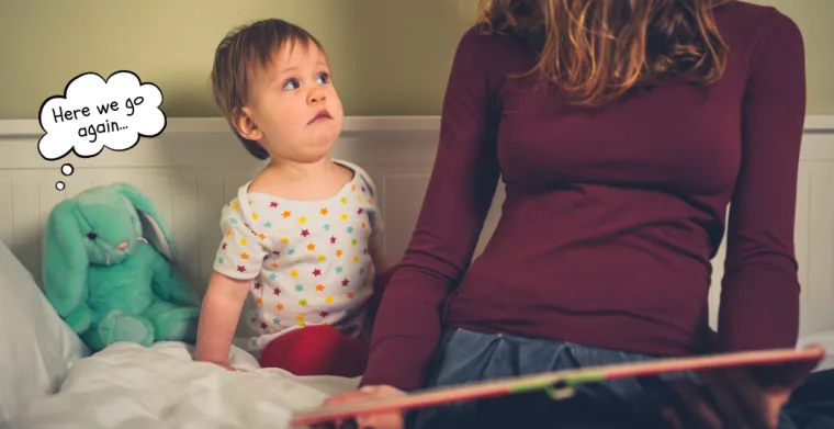 Child looking worried as book is being read by adult